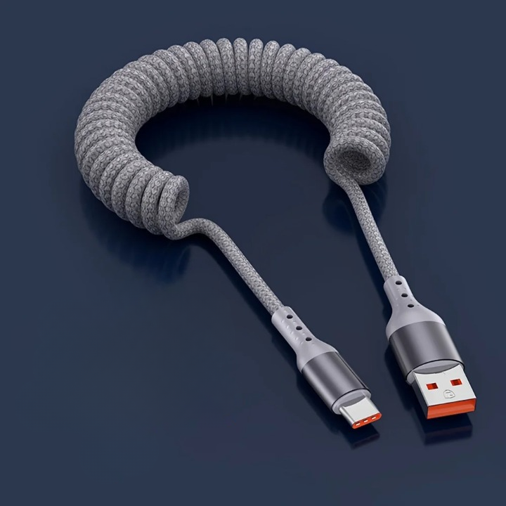 Universele 100W USB-C veerkabel voor snelladen en snelle dataoverdracht van je telefoon en laptop.