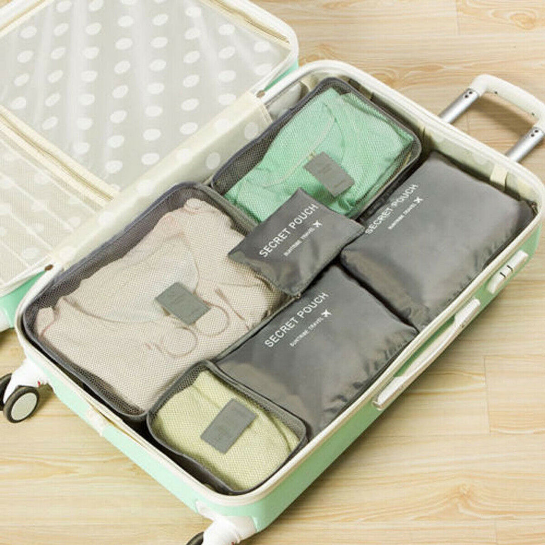 Duurzame Oxford stoffen inpakcubes; complete set voor optimale ruimtebesparing in je koffer.