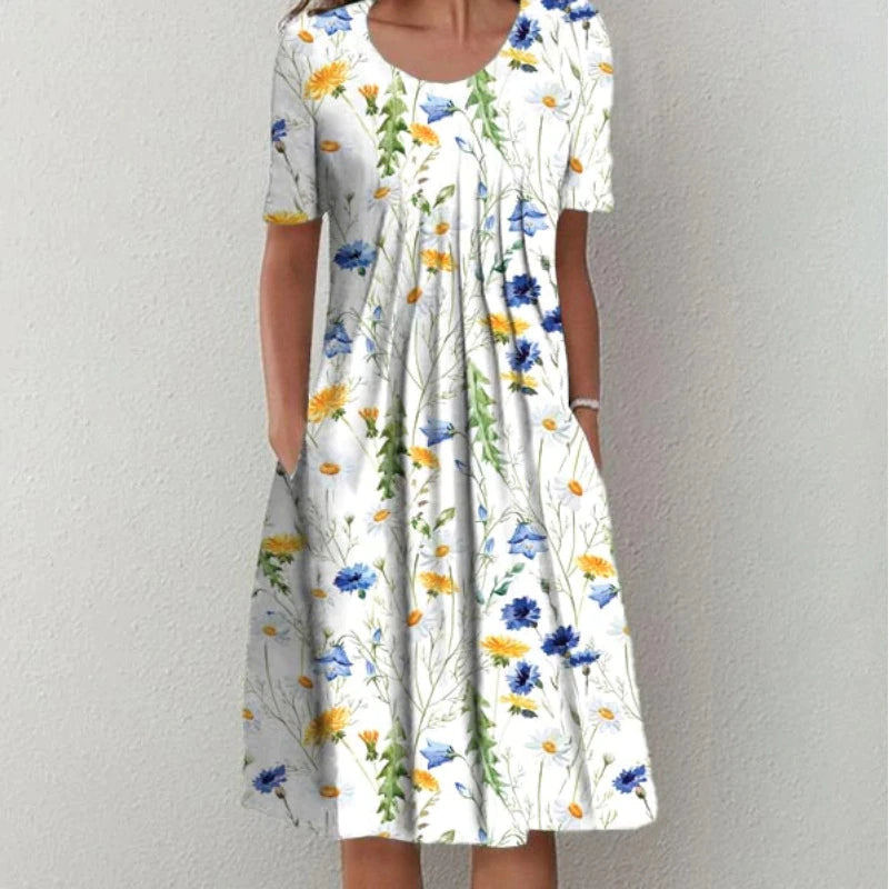 Elegante casual dames midi jurk met kleurrijke bloemenprint en v-hals. Perfect voor de zomer, inclusief zakken.