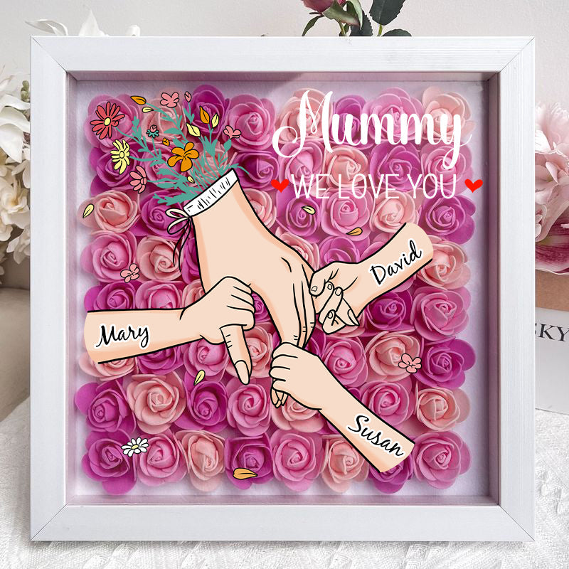 Sfeervolle schaduwbox met namen, een uniek interieur decoratie voor familieherinneringen.
