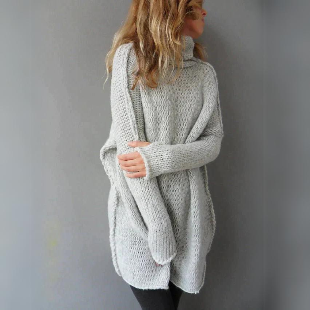 Zwarte dames coltrui, lang en warm gebreid. Comfortabele herfst/winter trui met chique uitstraling.