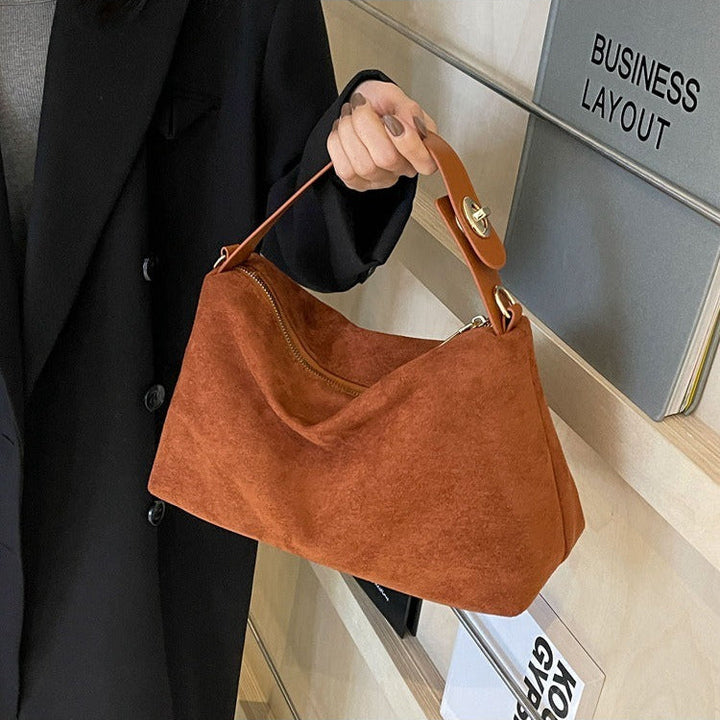 Bruine retro dames schoudertas, stijlvol en veelzijdig, ideaal als elegante handtas accessoire.