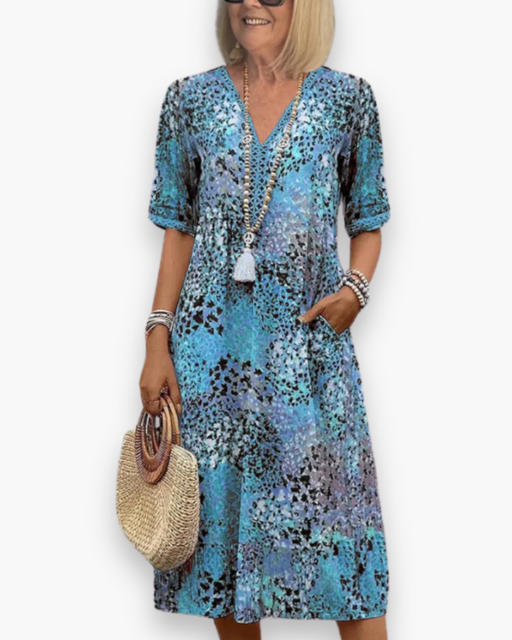 Elegante dames midi-jurk met bloemenprint, perfect voor lente en zomer. Comfortabele pasvorm en zwierige stof.