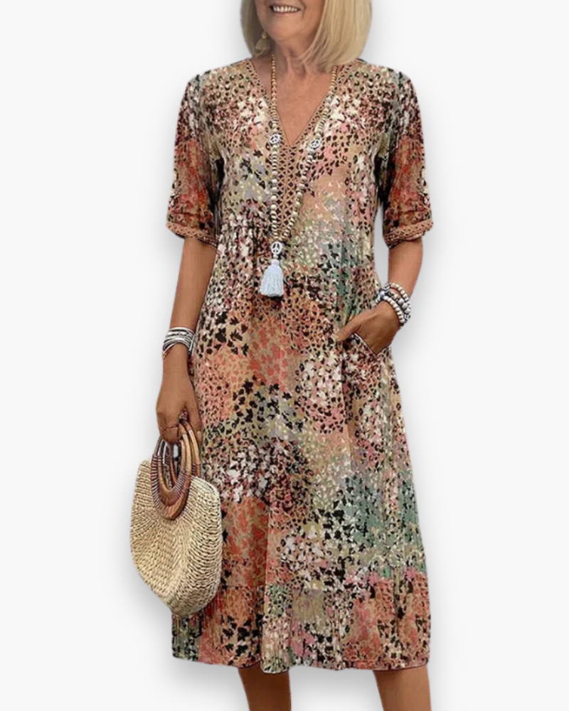 Veelzijdige dames midi-jurk met bloemenprint. Een comfortabele lente- of zomerjurk, ideaal voor elke gelegenheid.