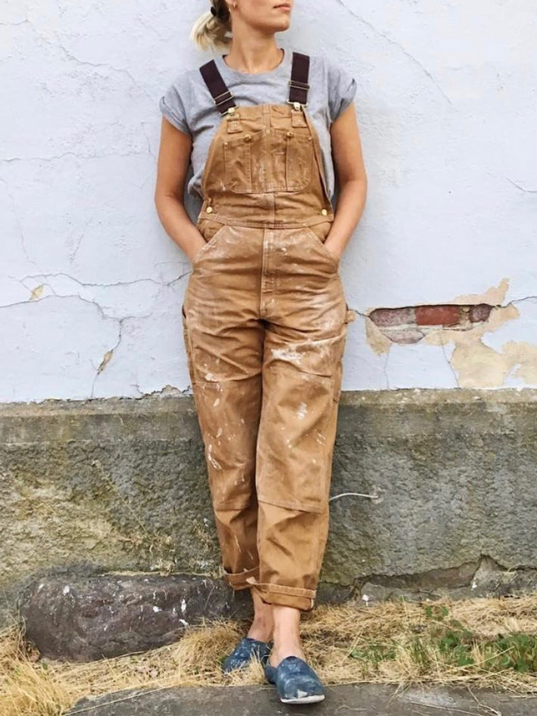 Zwarte robuuste canvas werkoverall, unisex model, functioneel en duurzaam voor professioneel gebruik.