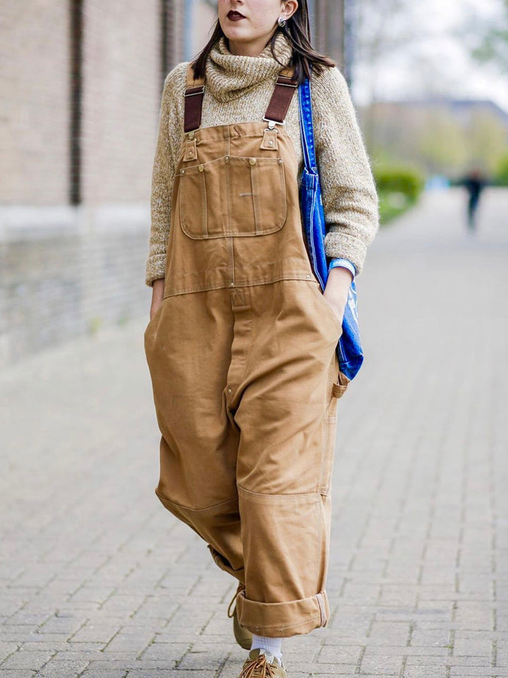 Stevige katoenen canvas werkoverall, unisex en ontworpen voor duurzaamheid en comfort bij klussen.