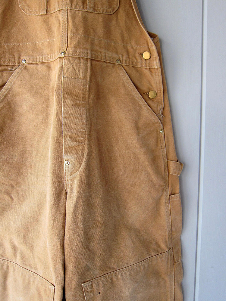 Unisex canvas werkoverall, veelzijdig voor tuinieren, boerderij of ambachtelijke klussen. Stevig katoen.
