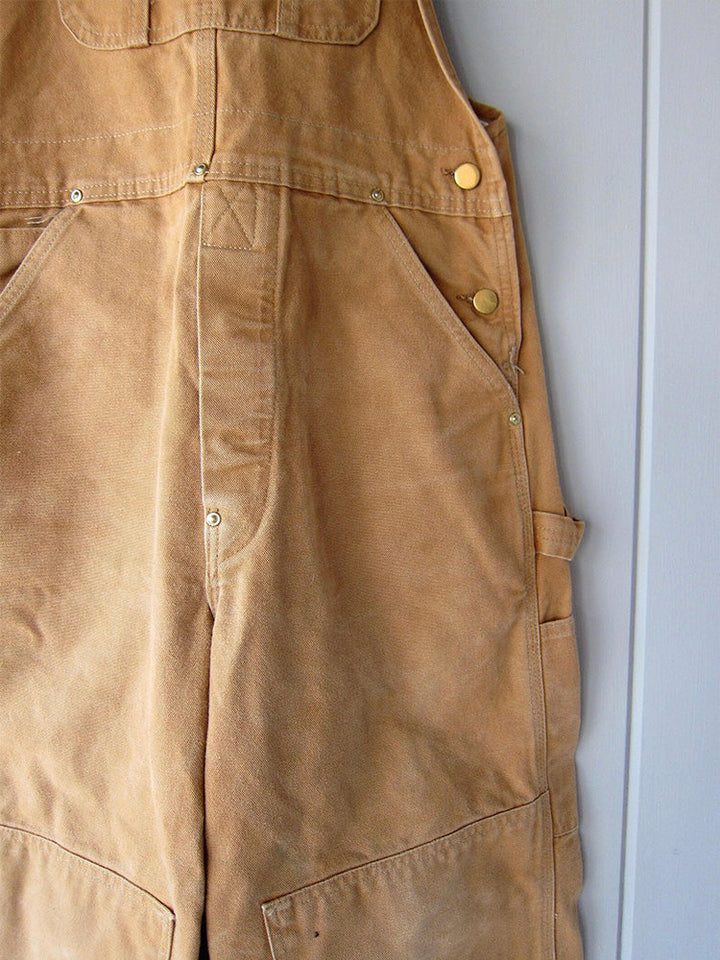 Unisex canvas werkoverall, veelzijdig voor tuinieren, boerderij of ambachtelijke klussen. Stevig katoen.