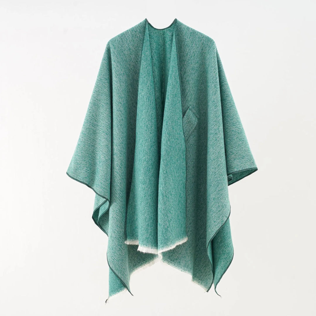 Zachte, stijlvolle retro damesponcho met kasjmierlook. Comfortabel loose fit vest voor dameskleding.