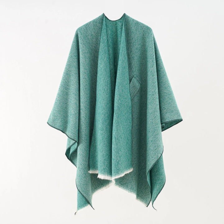 Zachte, stijlvolle retro damesponcho met kasjmierlook. Comfortabel loose fit vest voor dameskleding.