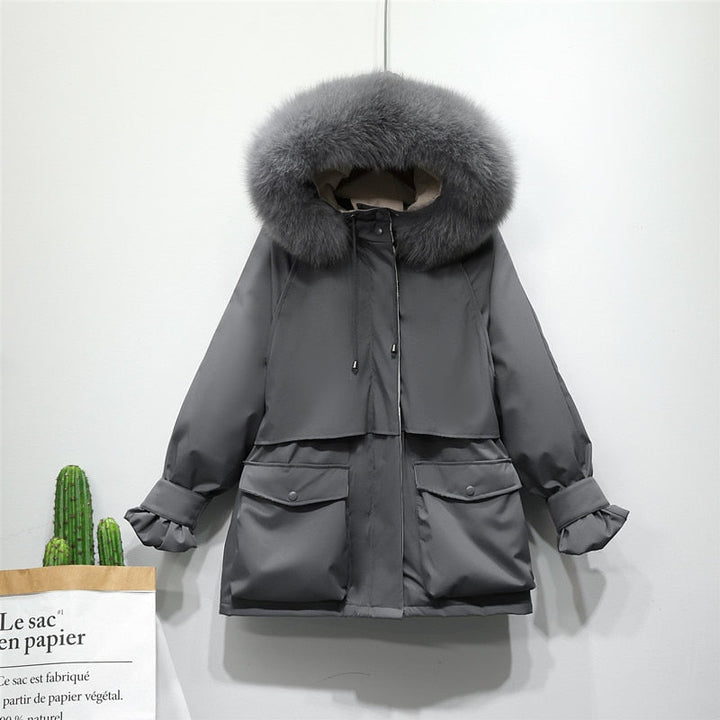Stijlvolle en warme dames winterjas, thermisch en elegant, essentieel voor mode en comfort.