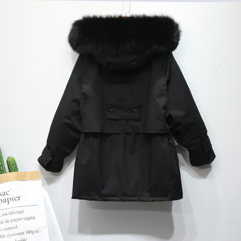 Ultieme warmte in deze elegante dames winterjas, perfecte buitenkleding voor koudebescherming.