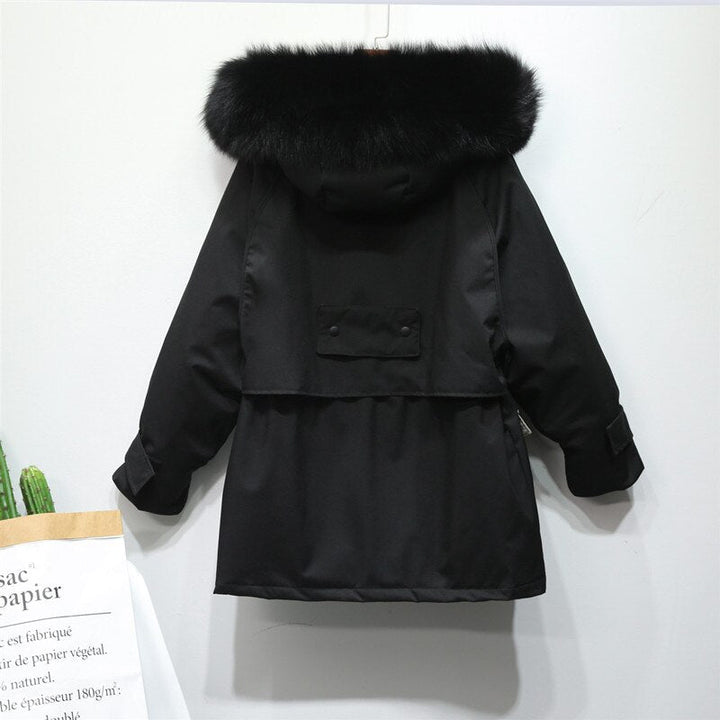 Ultieme warmte in deze elegante dames winterjas, perfecte buitenkleding voor koudebescherming.