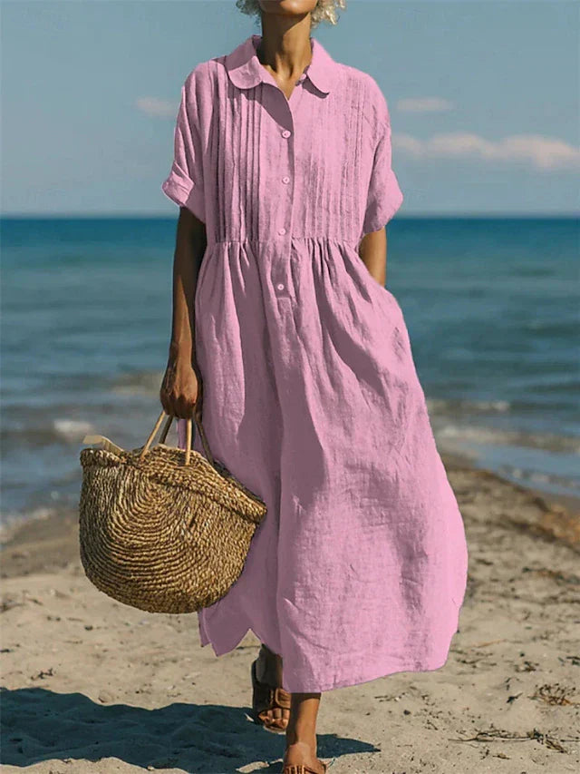 Stijlvol dames hemdblusenkleed in een levendige roze kleur, ideaal voor een casual-chique look.