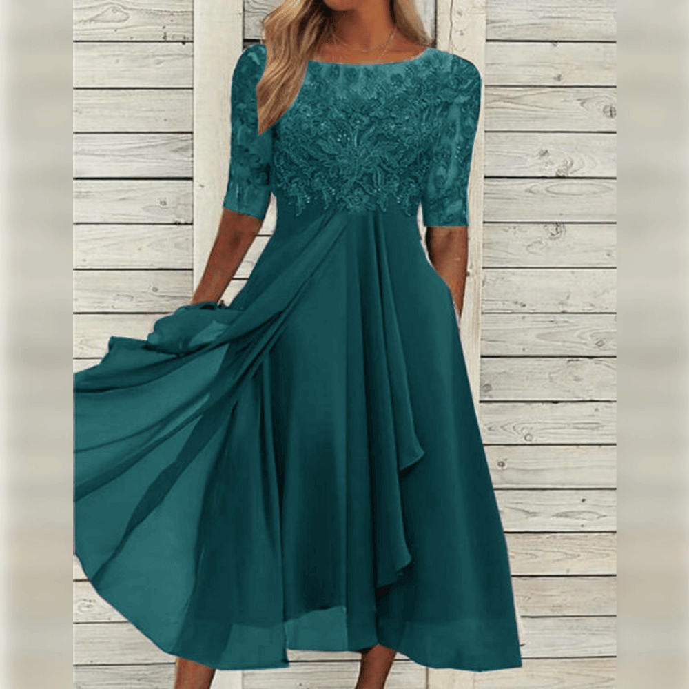 Turquoise kanten damesjurk voor zomerse gelegenheden