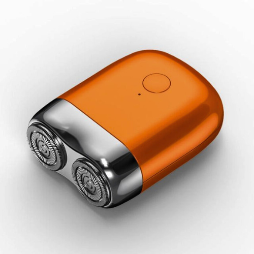 Het ShaveSmooth mini scheerapparaat in helder oranje, klaar voor gebruik.