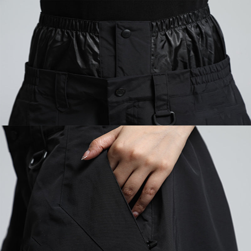 Veelzijdige zwarte baggy skibroek, unisex, warm en waterafstotend voor outdoor en wintersport.