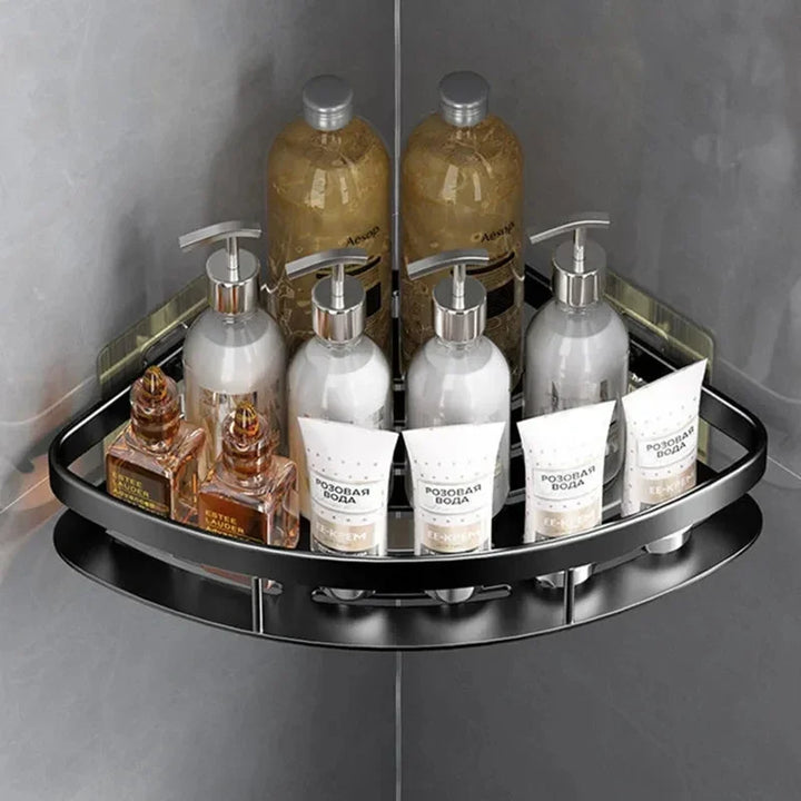 Zwart aluminium badkamer wandrek met flacons en tubes in de douche
