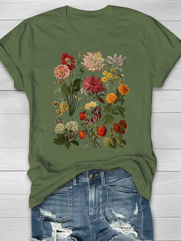 Groen dames T-shirt voorzien van een kleurrijk botanisch bloemendesign