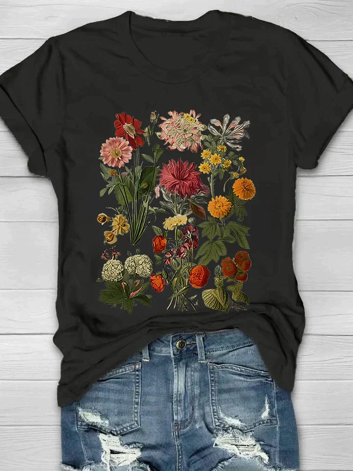 Dames T-shirt met zwarte basis en gedetailleerde vintage bloemenprint