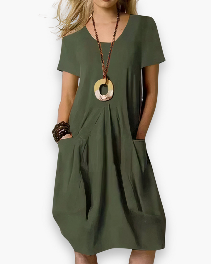 Stijlvolle dames zomerjurk in donkergroen, ideaal voor een relaxte en modieuze look.