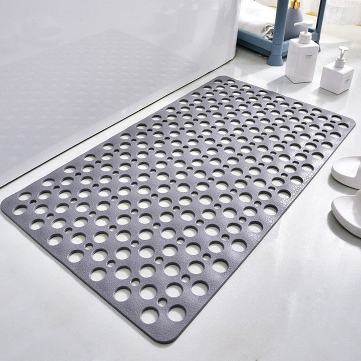 Antislip douchemat met innovatieve zuignappen voorkomt uitglijden; ideaal voor natte badkamervloeren.