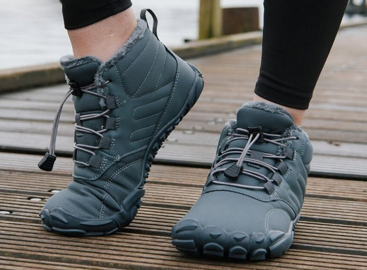 "ArcticBare Flex winter barefoot schoenen, antislip, waterdicht, uniseks, outdoor, zwart met rubberen zolen."