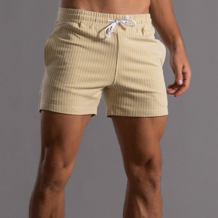 Details van de tailleband en stof van de gele Arno heren fitness shorts