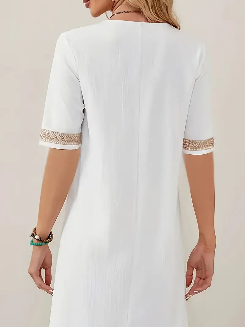 Elegante dames midi zomerjurk van luchtig linnen, ideaal als comfortabele casual mode voor warme dagen.