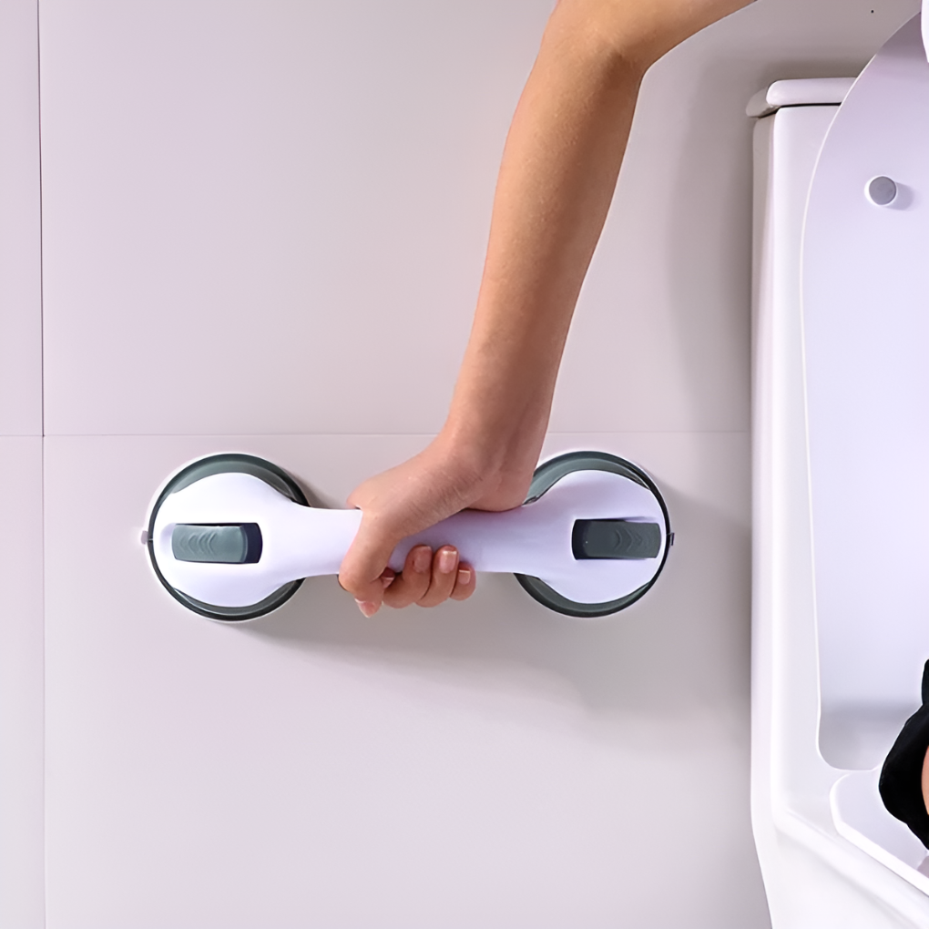 Compacte antislip zuiggreep voor badkamer, hulpmiddel voor veilig houvast en comfort bij in- en uitstappen.