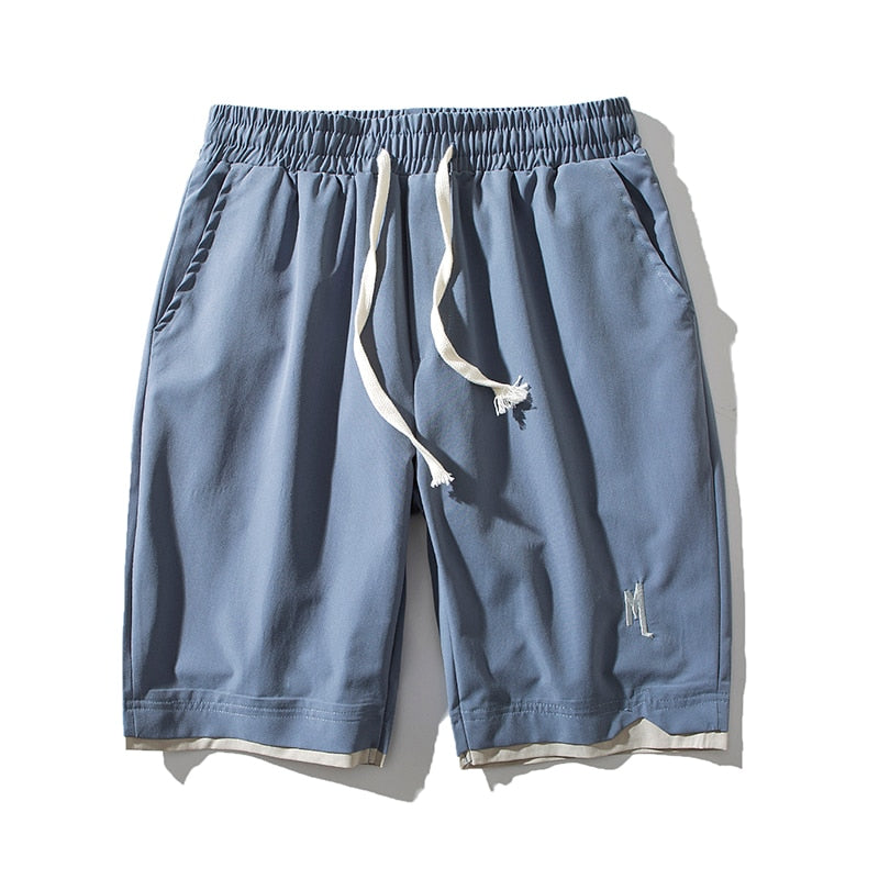 Rode Dante zomershorts voor heren, lichtgewicht met zakken, perfect voor strand of sportief gebruik.