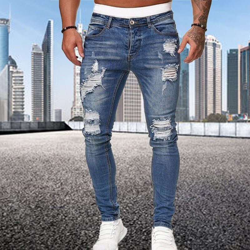 Blauwe heren ripped jeans slim fit. Comfortabele casual broek met gedurfde stijl, perfect voor streetwear mode.