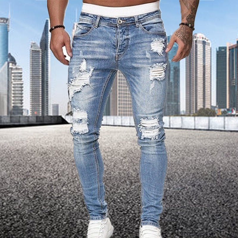 Grijze heren ripped jeans, slim fit model. Veelzijdige casual broek die comfort combineert met een gedurfde stijl.
