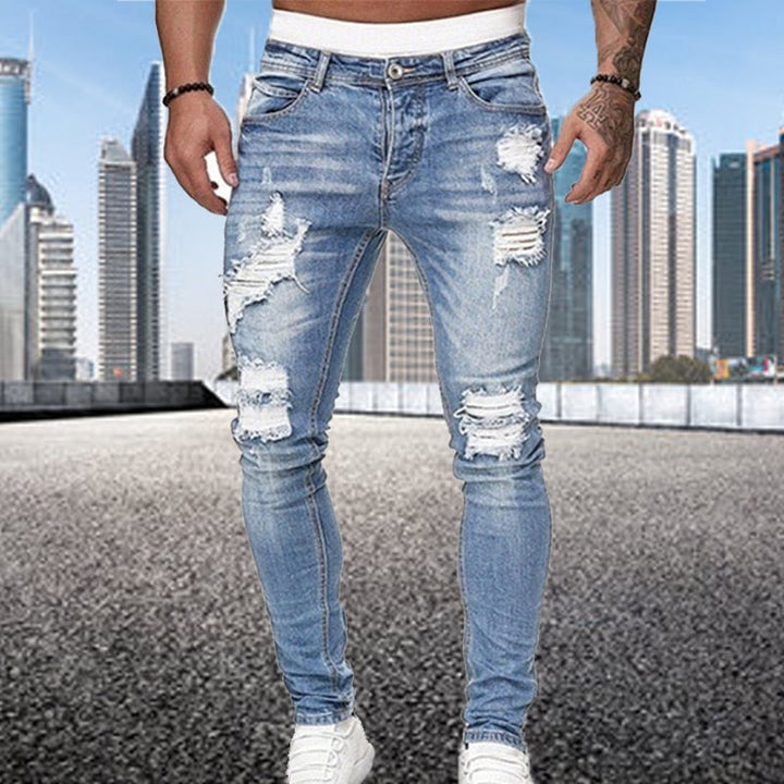 Grijze heren ripped jeans, slim fit model. Veelzijdige casual broek die comfort combineert met een gedurfde stijl.
