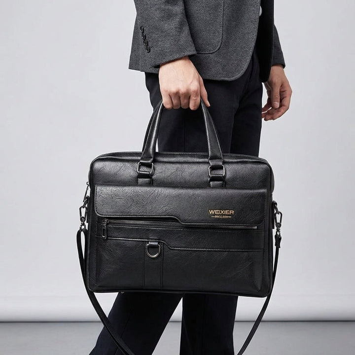 Donkerbruine laptoptas/schoudertas MetroBrief van PU leer met handige schouderband voor werk en reizen.