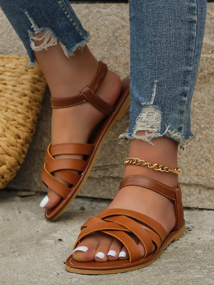 Antislipzool van bruine Romeinse dames sandalen Yvelle, voor extra grip en stabiliteit op diverse ondergronden.
