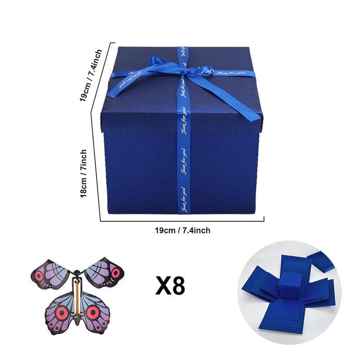Papieren DIY explosiebox met vliegende vlinders. Maak een persoonlijk cadeau voor je geliefden.
