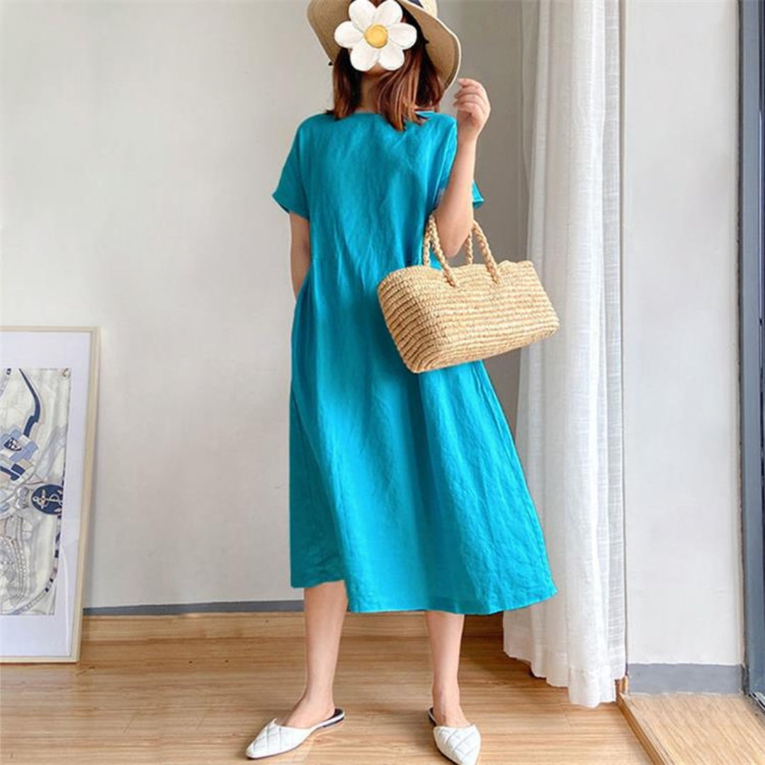 Luchtige casual zomerjurk dames, midi lengte, korte mouwen, ideaal voor warme dagen.
