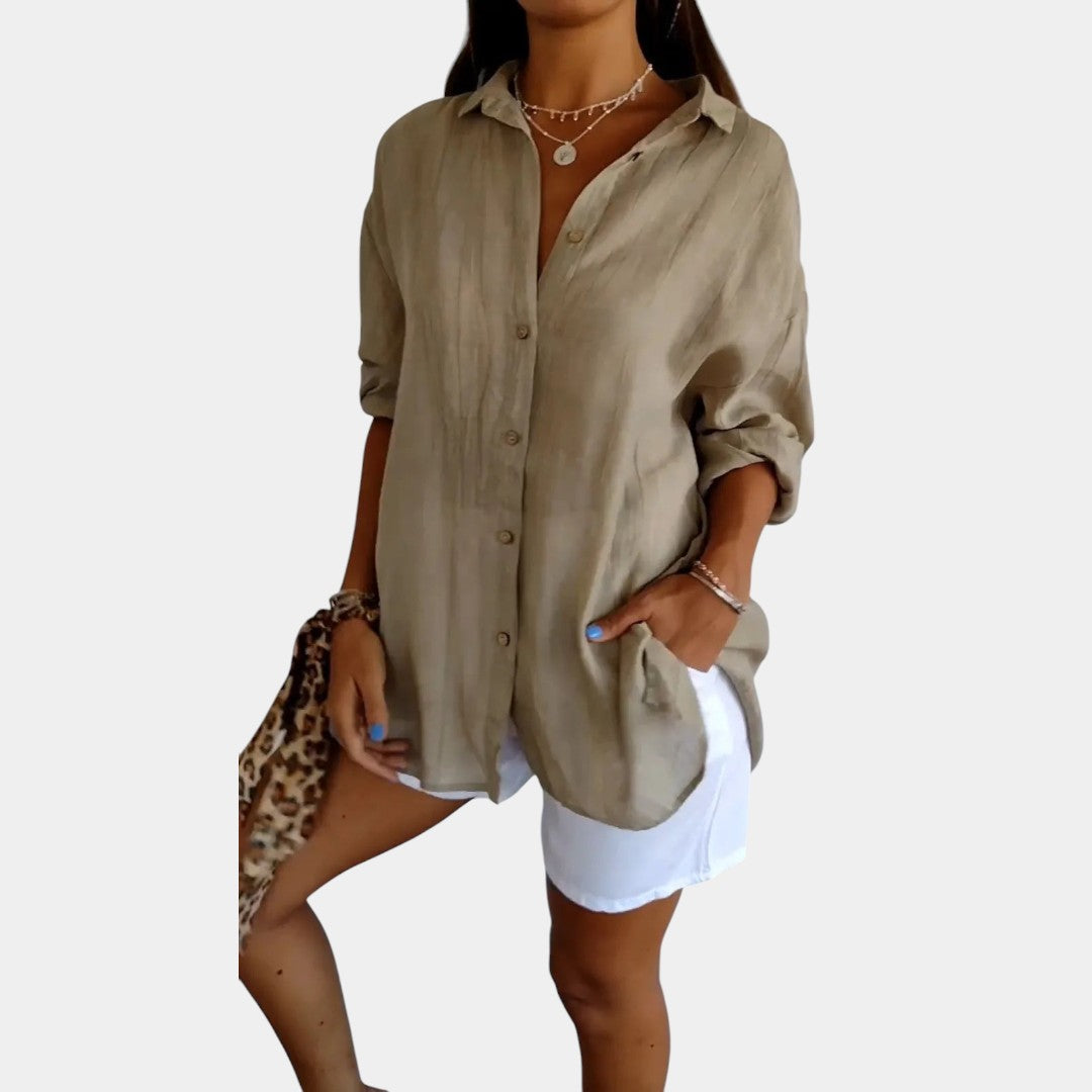 Luchtige zomer damesblouse effen, met lange mouwen. Ideaal voor een comfortabele, modieuze look in de lente.