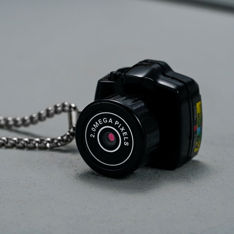 Compacte HD mini videocamera, draagbaar ontwerp met schokbestendige behuizing, ideaal voor scherpe 1080HD opnamen.