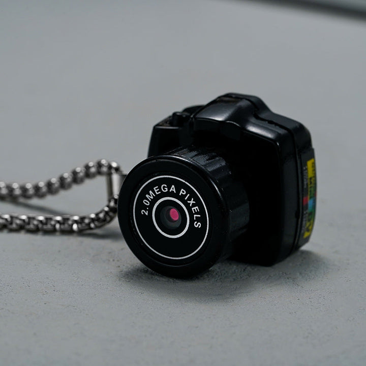 Compacte HD mini videocamera, draagbaar ontwerp met schokbestendige behuizing, ideaal voor scherpe 1080HD opnamen.