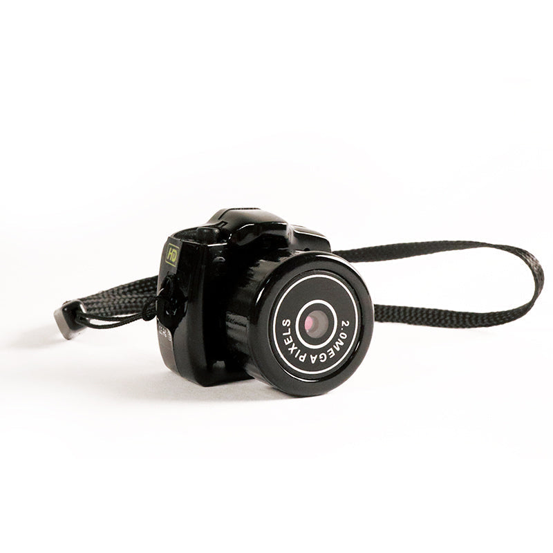 Compacte HD mini videocamera, draagbaar ontwerp met schokbestendige behuizing, ideaal voor scherpe 1080HD opnamen.