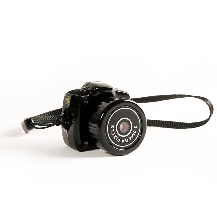 Compacte HD mini videocamera, draagbaar ontwerp met schokbestendige behuizing, ideaal voor scherpe 1080HD opnamen.