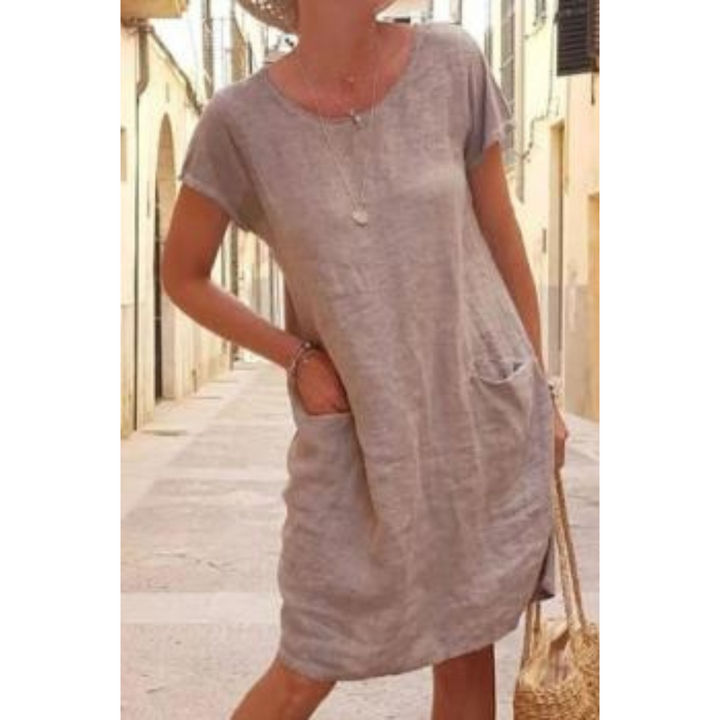 Comfortabele dames casual midi jurk met zakken, knielengte, korte mouwen en losse pasvorm. Ideaal voor de zomer.