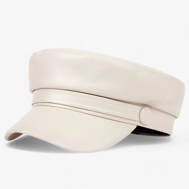 Dames achthoekige pet van glad PU-leer. Een verstelbaar en stijlvol item voor koeler weer.