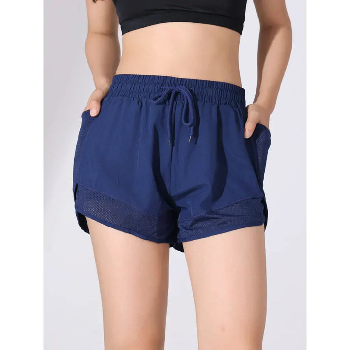 Comfortabele ademende high-waist dames sportshorts, sneldrogend en elastisch voor optimale bewegingsvrijheid.