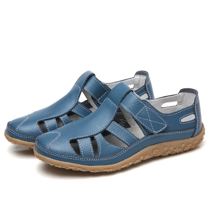 Gedetailleerd shot van de anti-slip zool van de comfortabele dames sandalen.