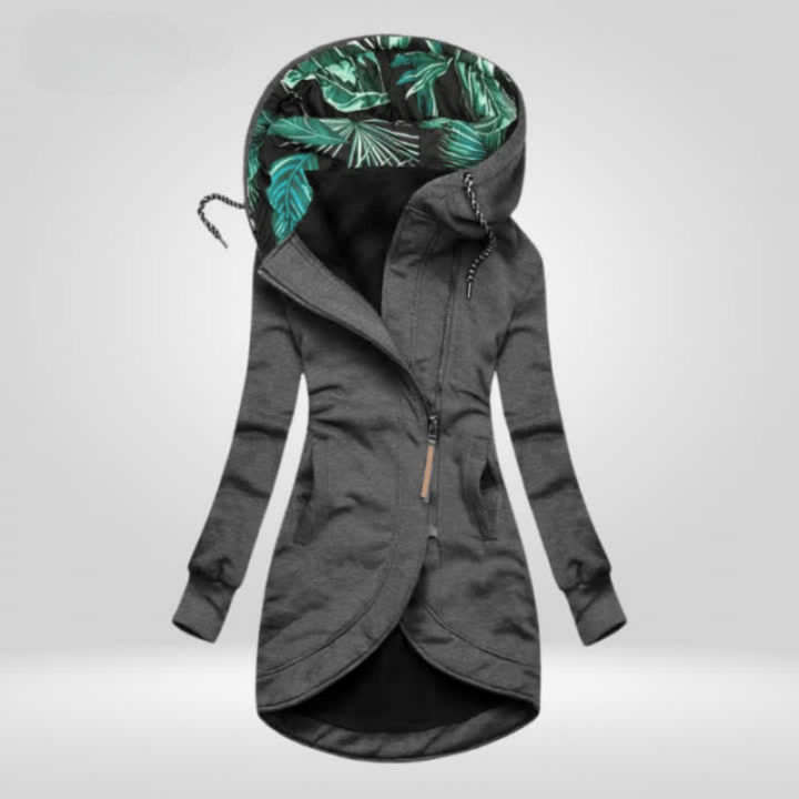 Modieuze dames winterjas met asymmetrisch design en capuchon; een lange, comfortabele outerwear.