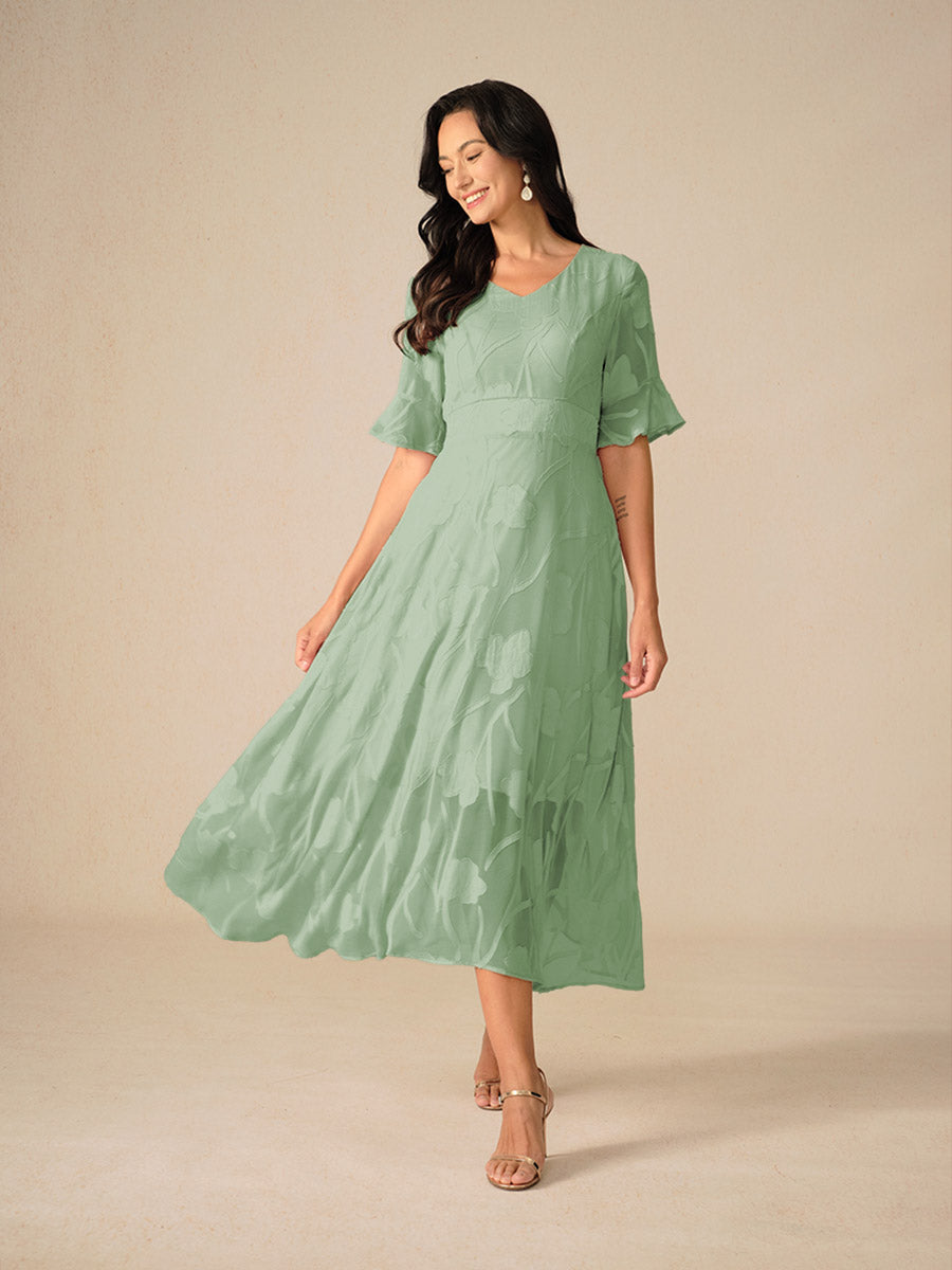 Zomerse bloemen midi jurk, A-lijn model met fladdermouwen. Comfortabel en elegant voor elke vrouw.