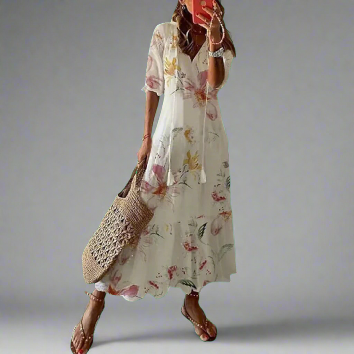 Elegante bloemen maxi jurk voor dames, A-lijn model met V-hals en korte mouwen. Ideaal voor feestjes.